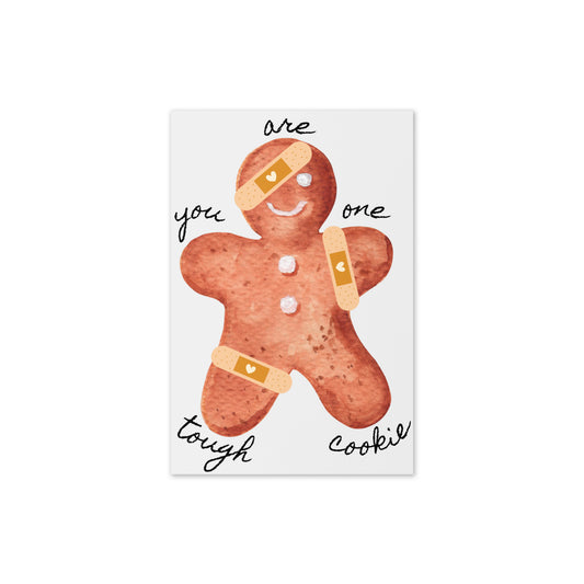 Gingerbread man with bandages and text on a white background