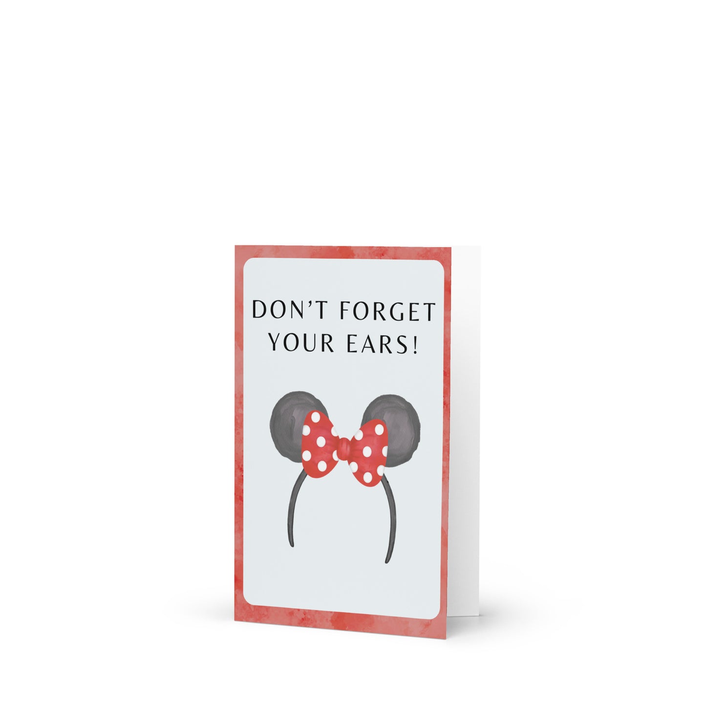 Card with Minnie Mouse ears design and text 'Don't forget your ears!' on a white background