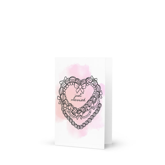 Greeting card with heart cake design and 'just married' text on a white background