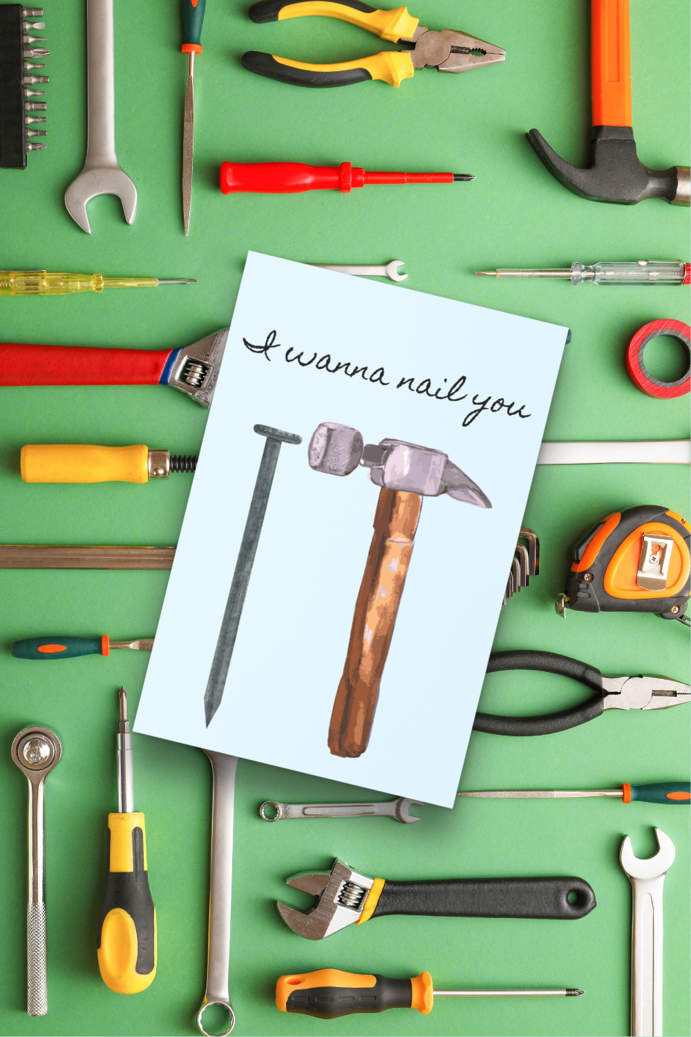 Tools on a green background with a card that says 'I wanna nail you'.