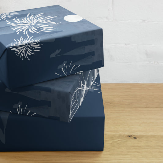 Stack of blue gift boxes with white patterns on a wooden surface.