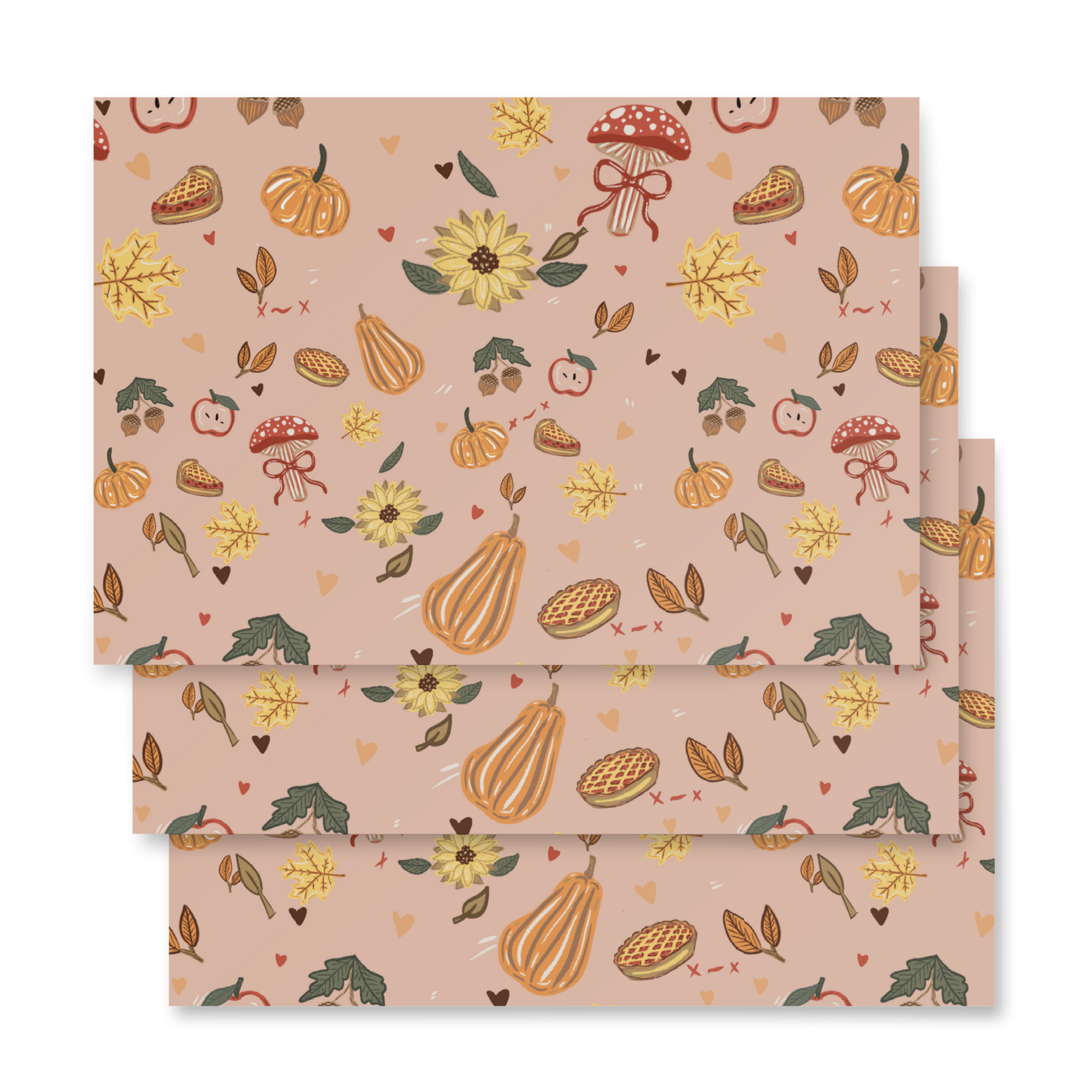A flat-lay view of premium matte wrapping paper featuring a hand-drawn pattern of fall icons—including colorful autumn leaves, acorns, and seasonal motifs—on a white background by Wishbrush.