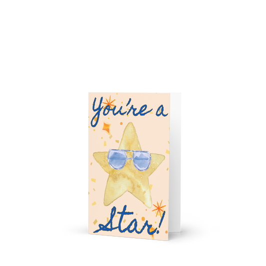 Greeting card with a star wearing sunglasses and text 'You're a star!' on a white background