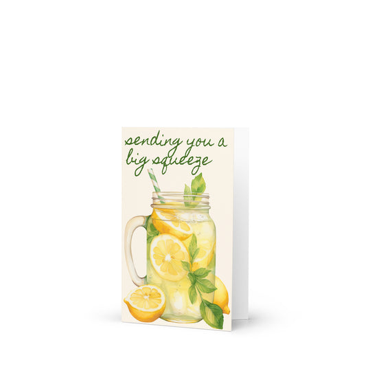 Card with a mason jar of lemons and text 'sending you a big squeeze' on a white background