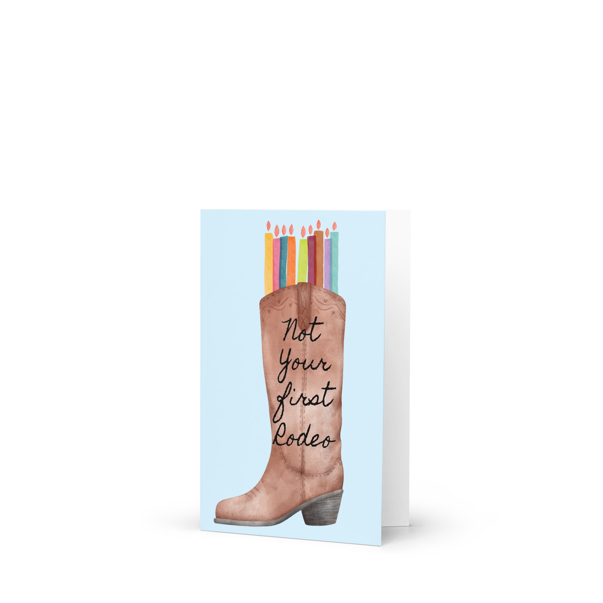 Card with a boot and candles design, featuring the text 'Not Your First Rodeo'.