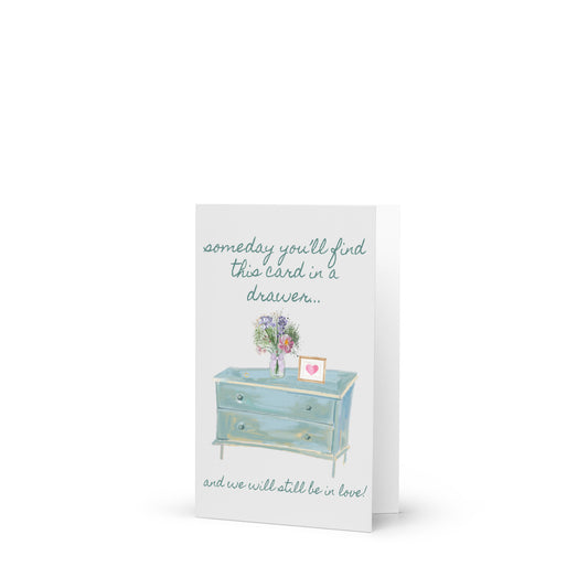 Greeting card with illustration of a dresser and flowers on a white background