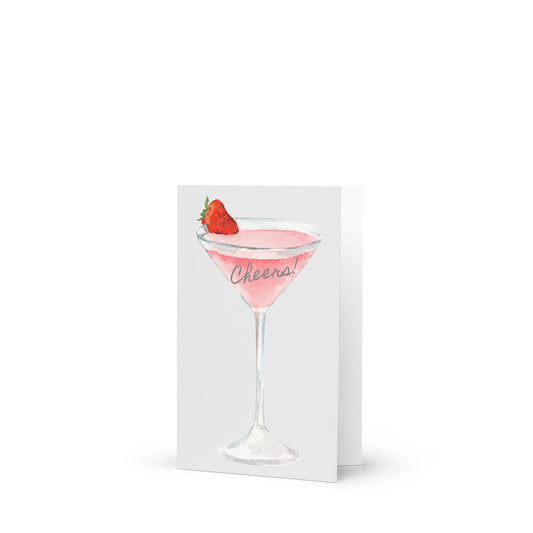 Card with a illustration of a pink cocktail with a strawberry and 'Cheers' text on a white background