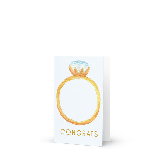 Greeting card with a gold ring design and 'Congrats' text on a white background