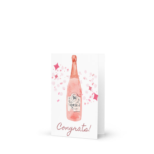 Greeting card with a pink champagne bottle and 'Congrats!' text on a white background