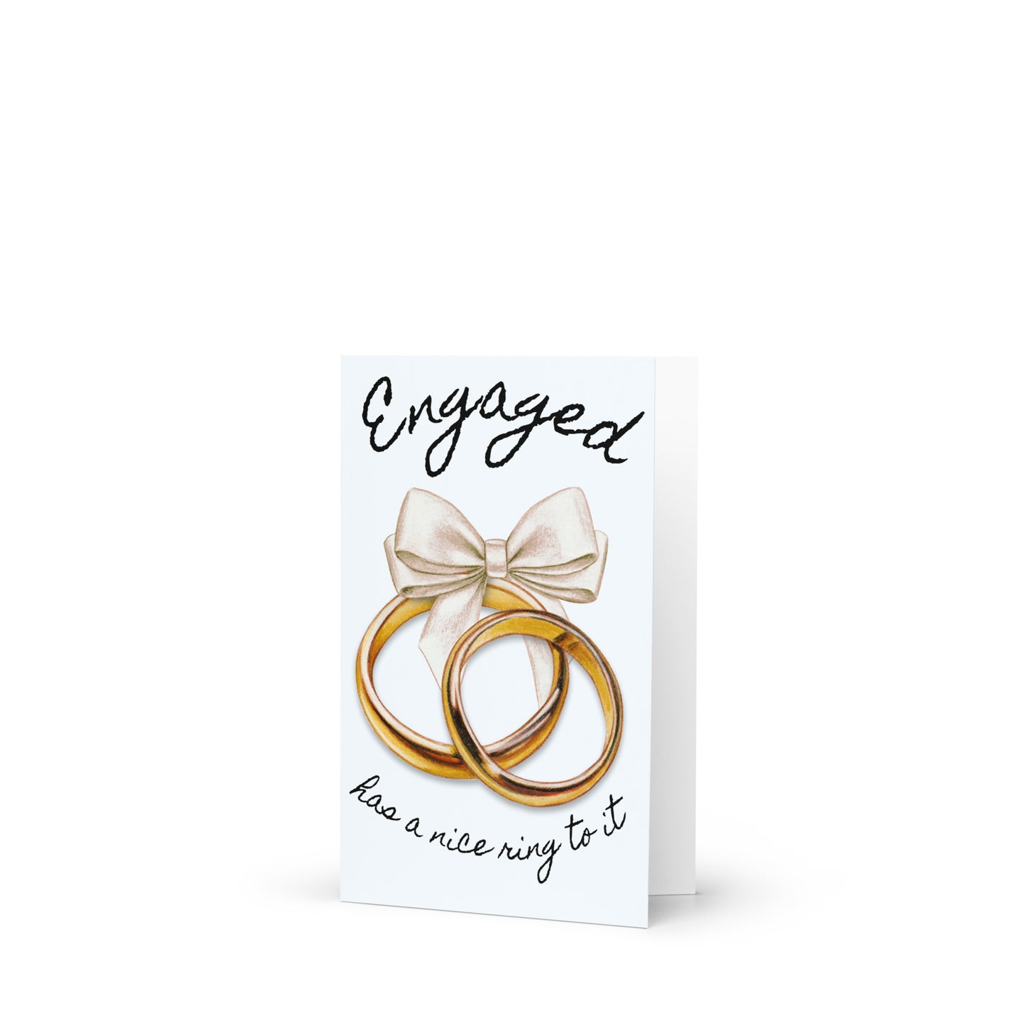 Greeting card with two gold rings and a bow, featuring the text 'Engaged has a nice ring to it' on a white background.
