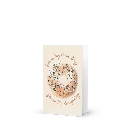 Greeting card with a bagel illustration and text on a white background