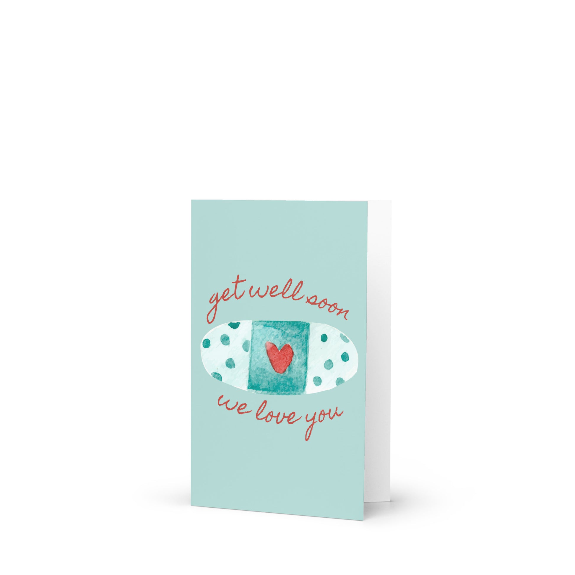 Greeting card with a bandaid and heart design on a light blue background