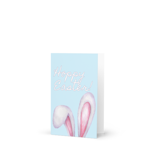 Greeting card with 'Happy Easter!' text and bunny ears on a light blue background