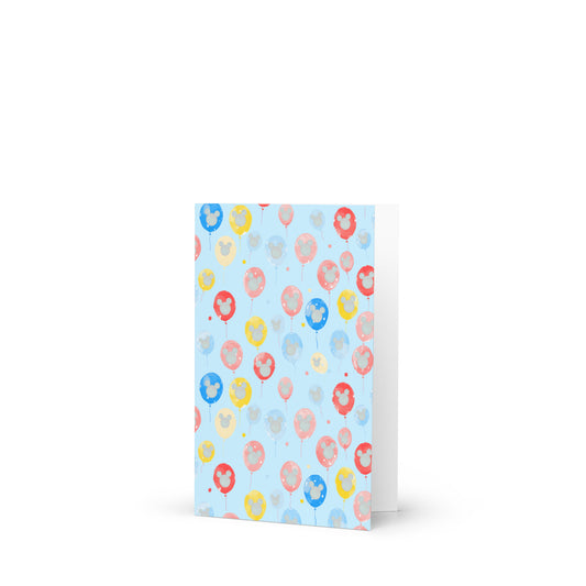 Notebook with colorful balloon pattern on a light blue background