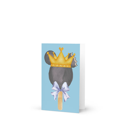 Greeting card with a design of a mouse head with a crown and bow on a blue background