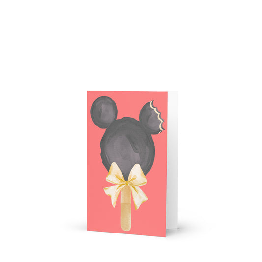 Greeting card with a black mouse head design on a pink background