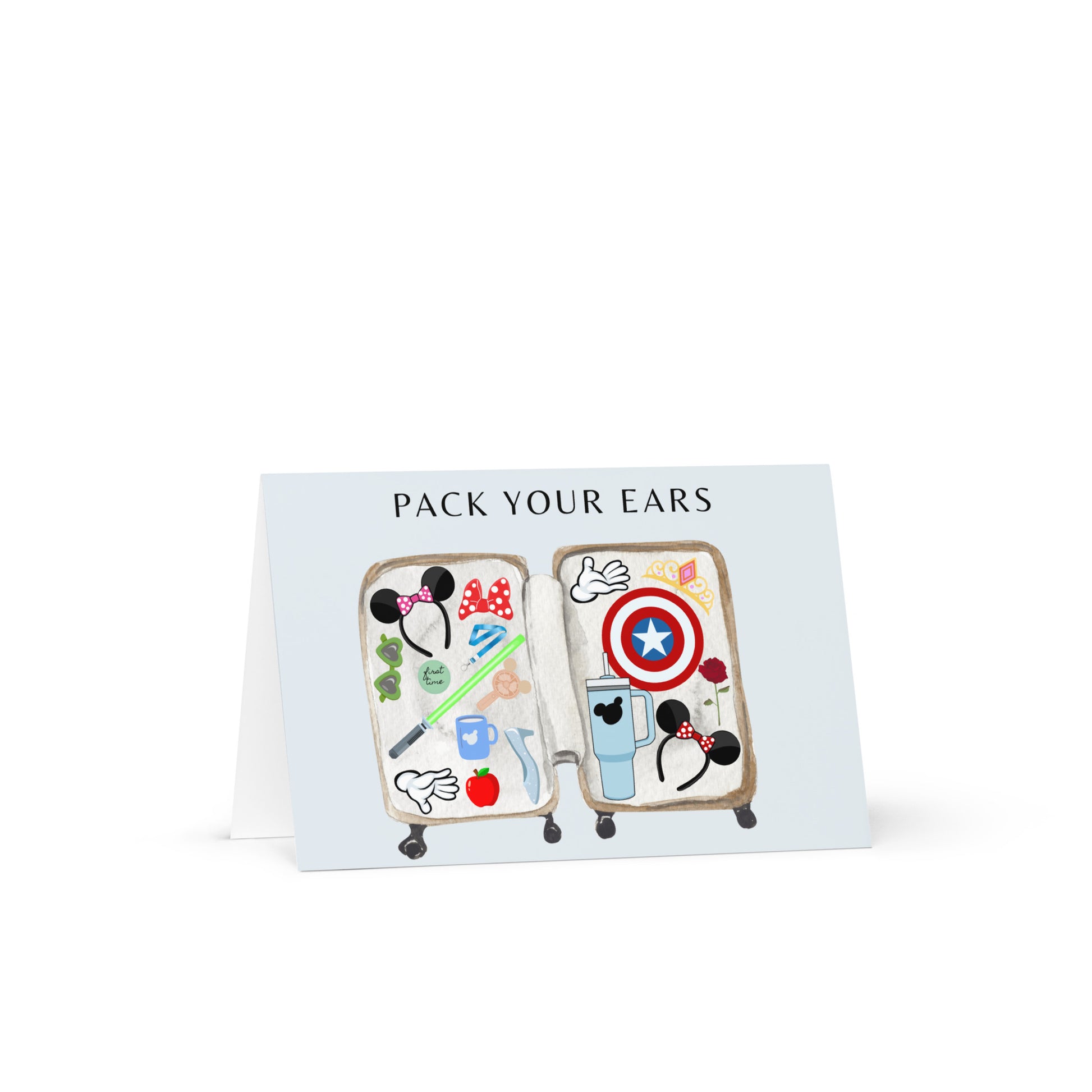 Pair of earrings with character designs on a card labeled 'Pack Your Ears' against a white background