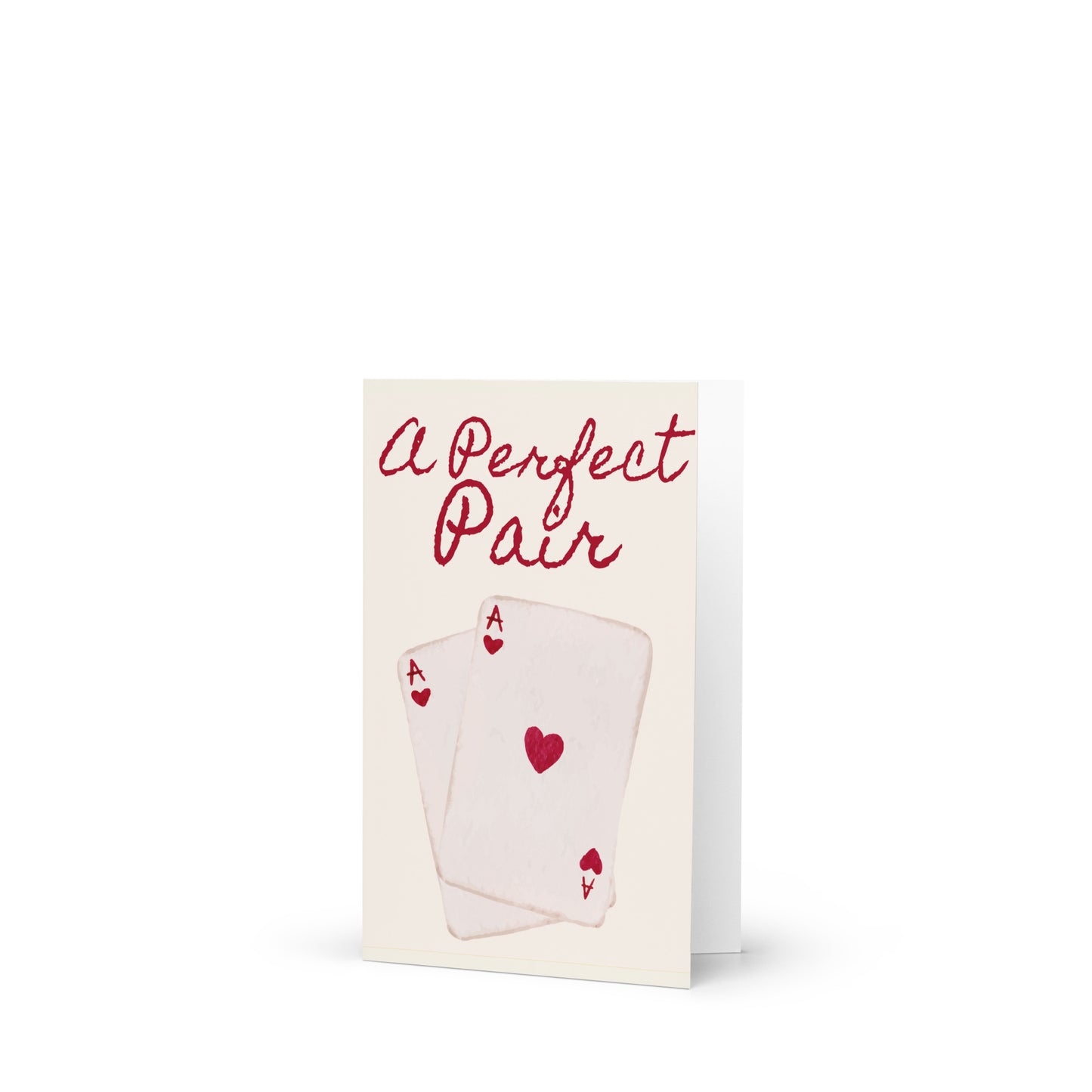 Greeting card with playing cards and 'A Perfect Pair' text on a white background