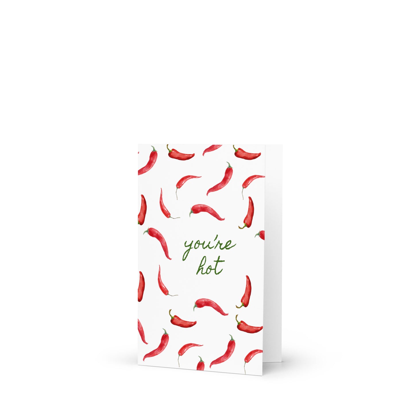 Greeting card with red chili pepper pattern and 'you're hot' text on a white background