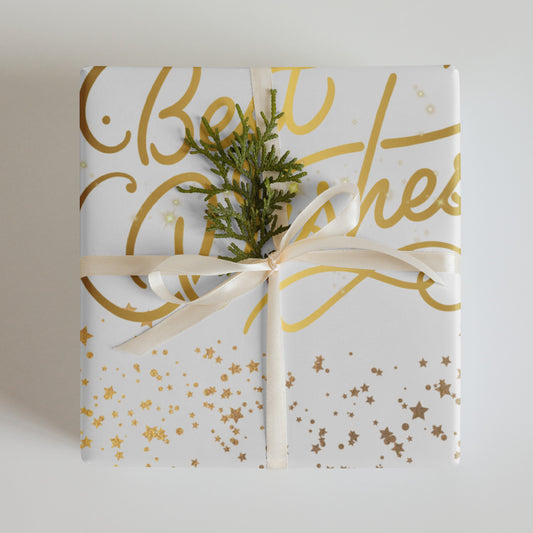 Gift wrapped in white paper with gold text and stars, tied with a ribbon and a small tree branch.