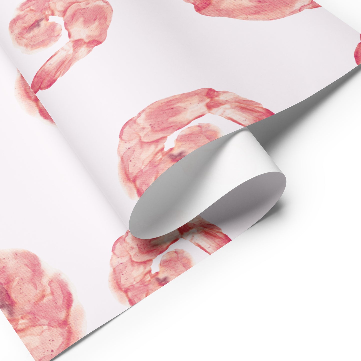 Roll of paper with pink shrimp pattern on a white background