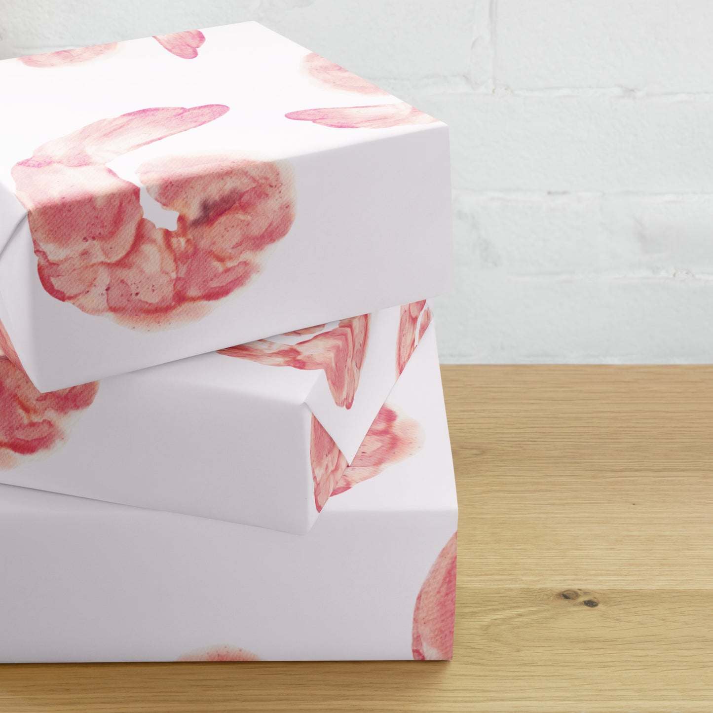 White box with pink shrimp pattern on a wooden surface