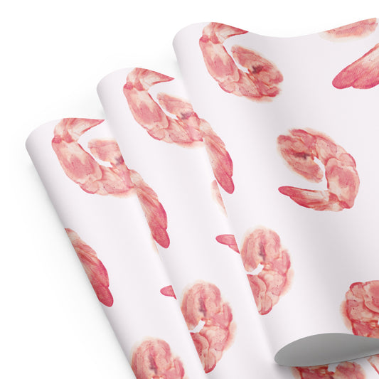 Two white towels with pink shrimp patterns on a white background