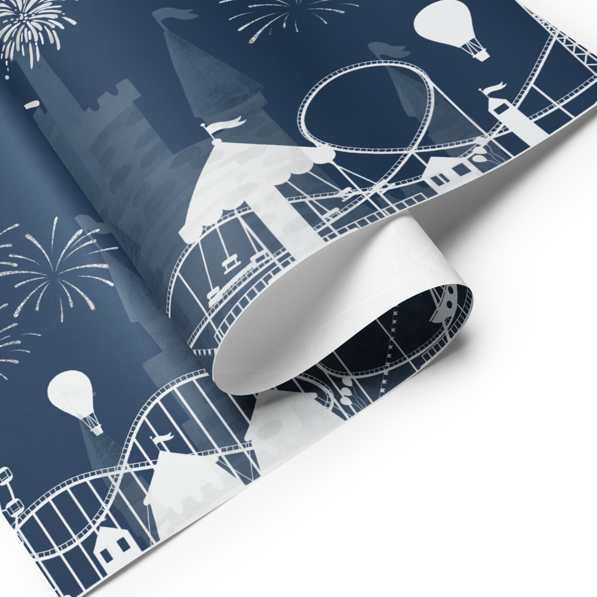 Roll of wrapping paper with white amusement park design on a blue background
