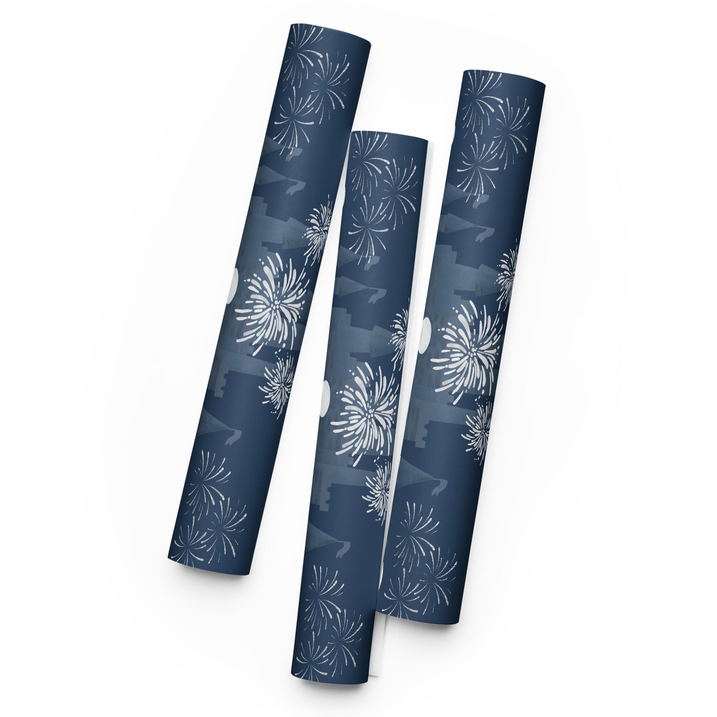 Three cylindrical wrapping paper rolls with patterns on a white background