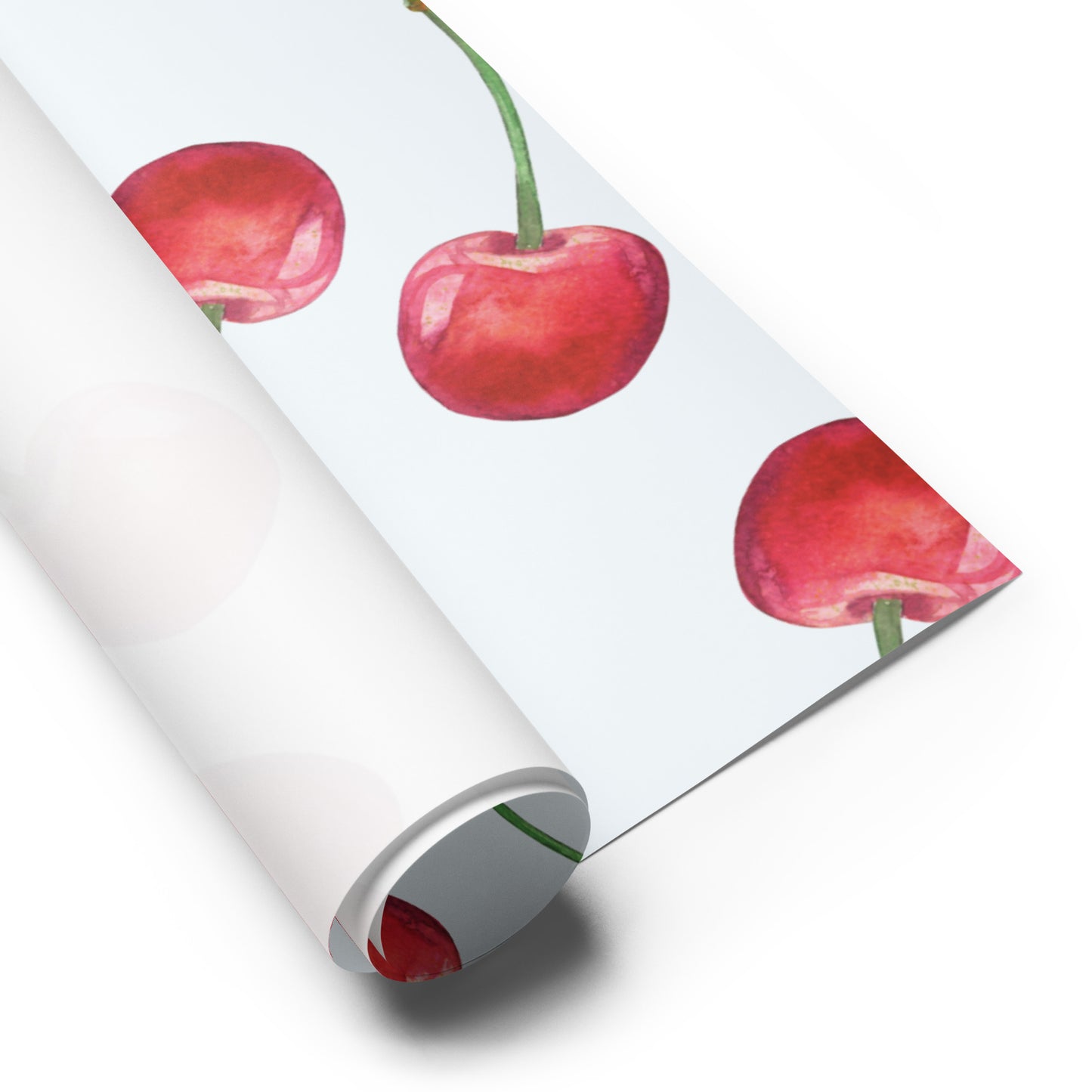 Roll of paper with red cherry design on a white background