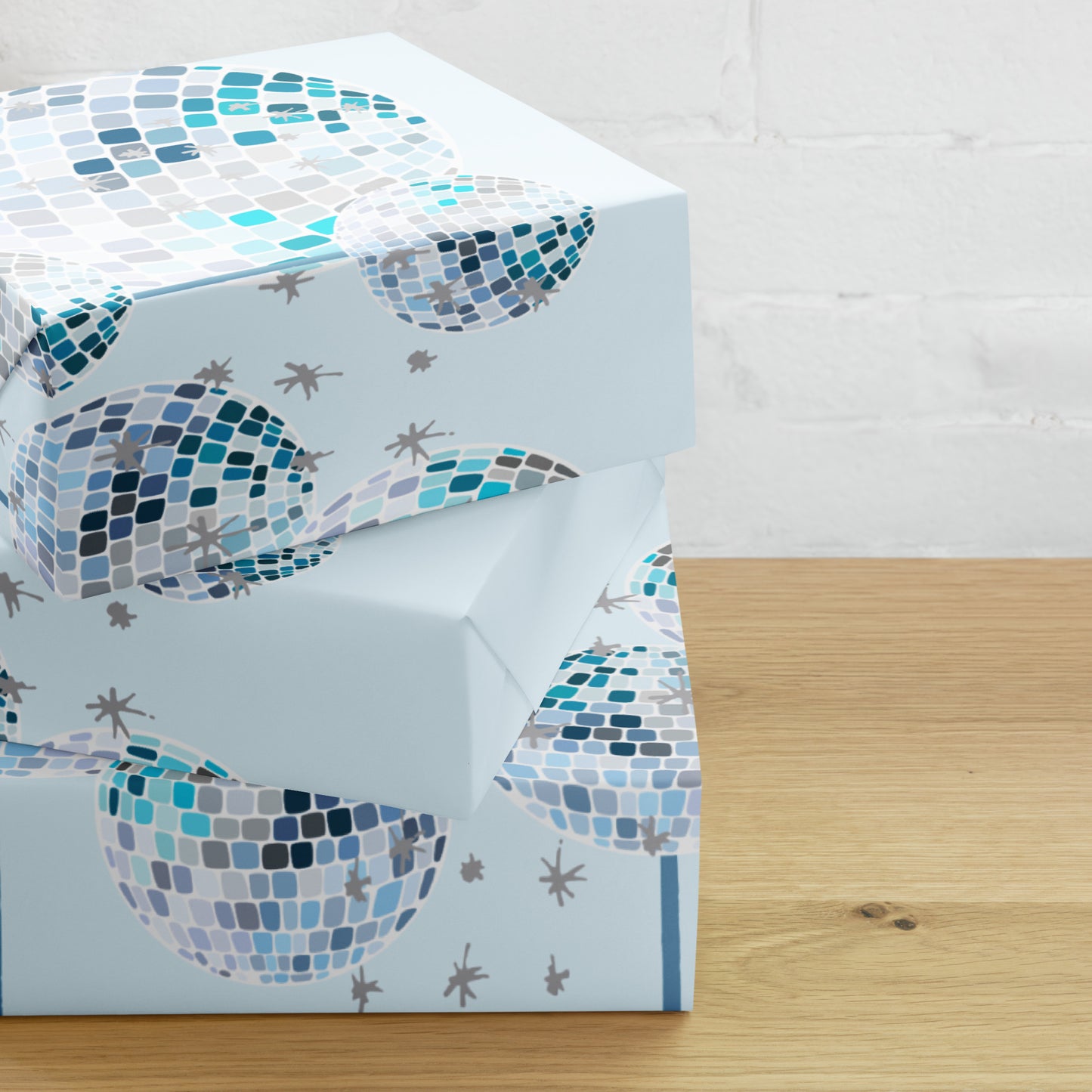 Packaged product with mosaic whale design on a light blue background