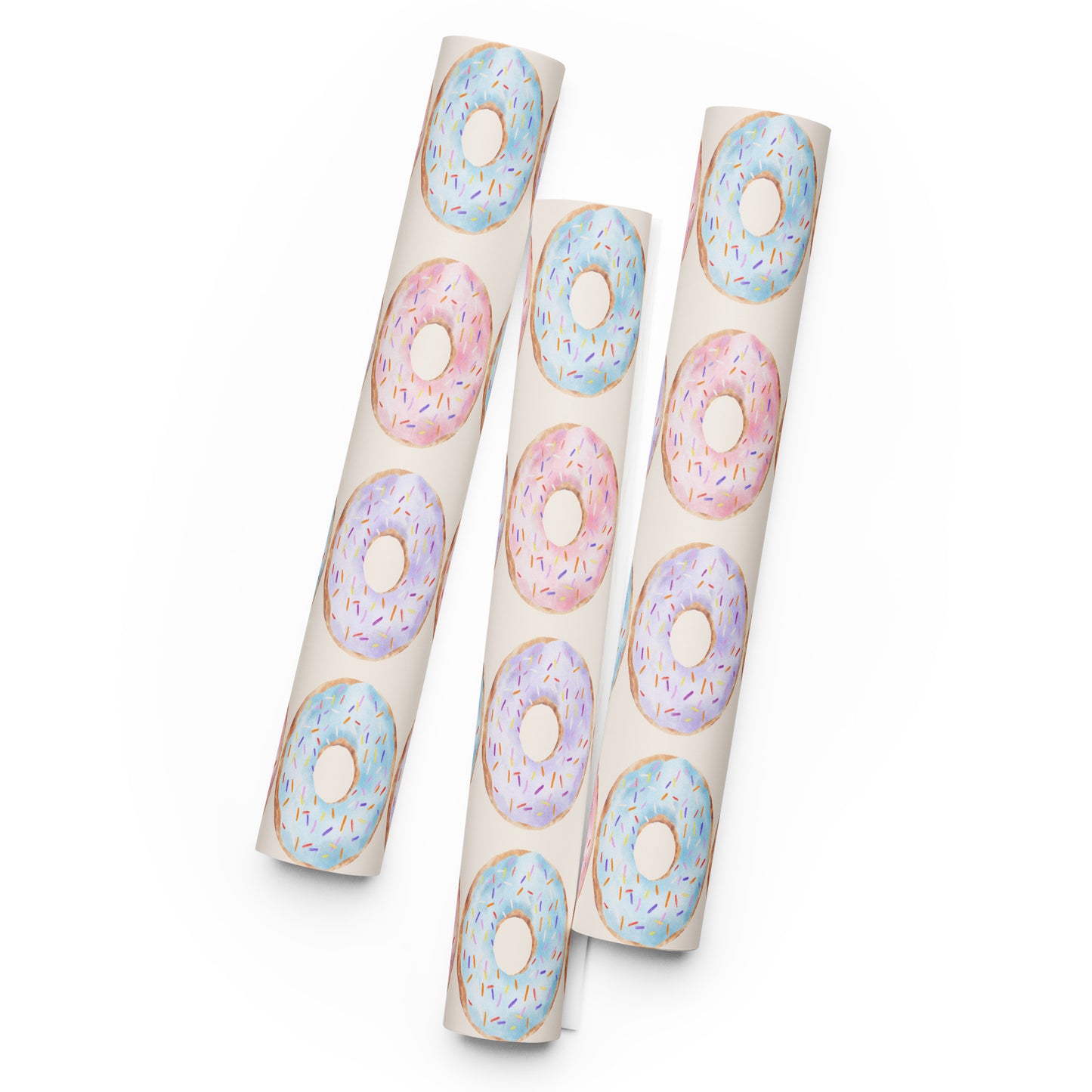 Three cylindrical paper tubes with colorful donut designs on a white background
