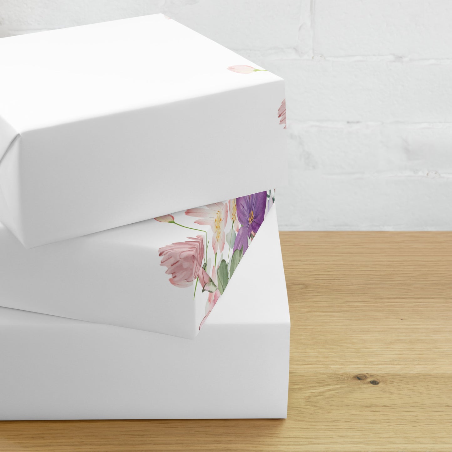 White box with floral patterned paper inside on a wooden surface