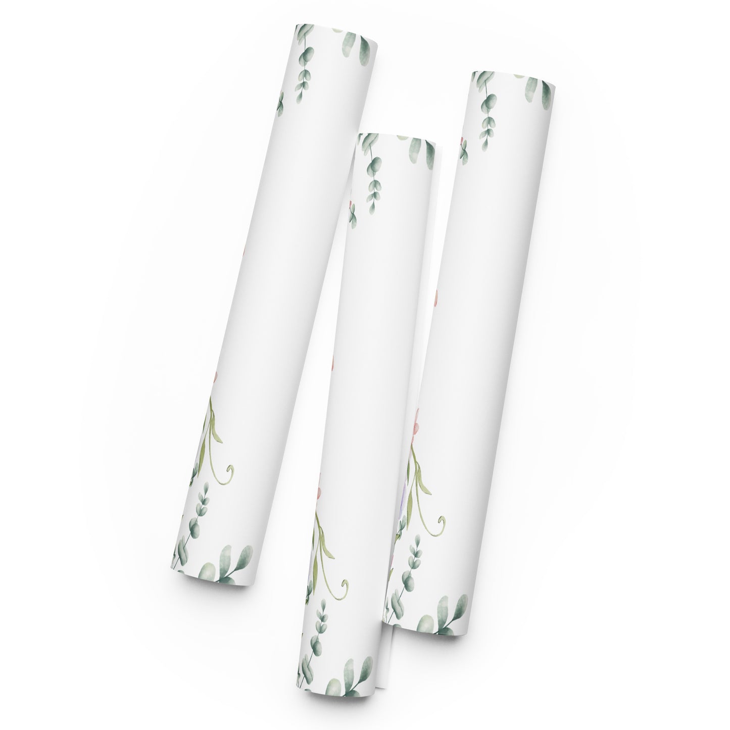 Three cylindrical paper rolls with floral patterns on a white background