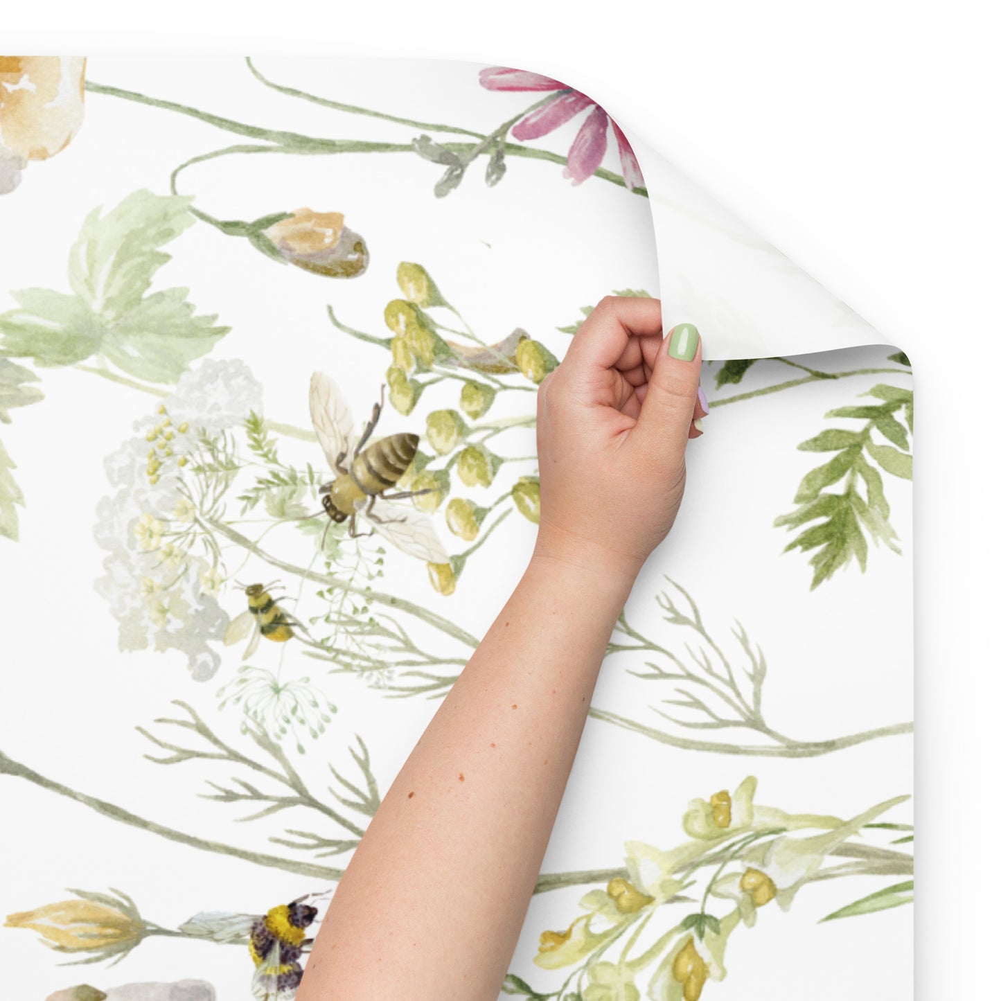 Floral wallpaper with a hand holding it, featuring bees and flowers.