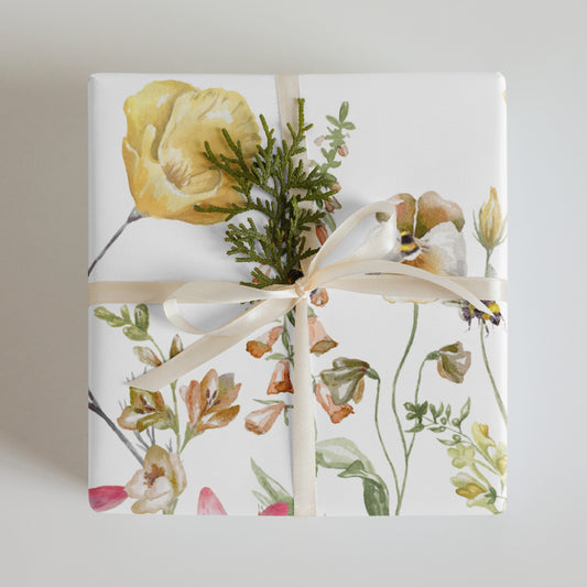 Gift wrapped in floral paper with a bow on a light background