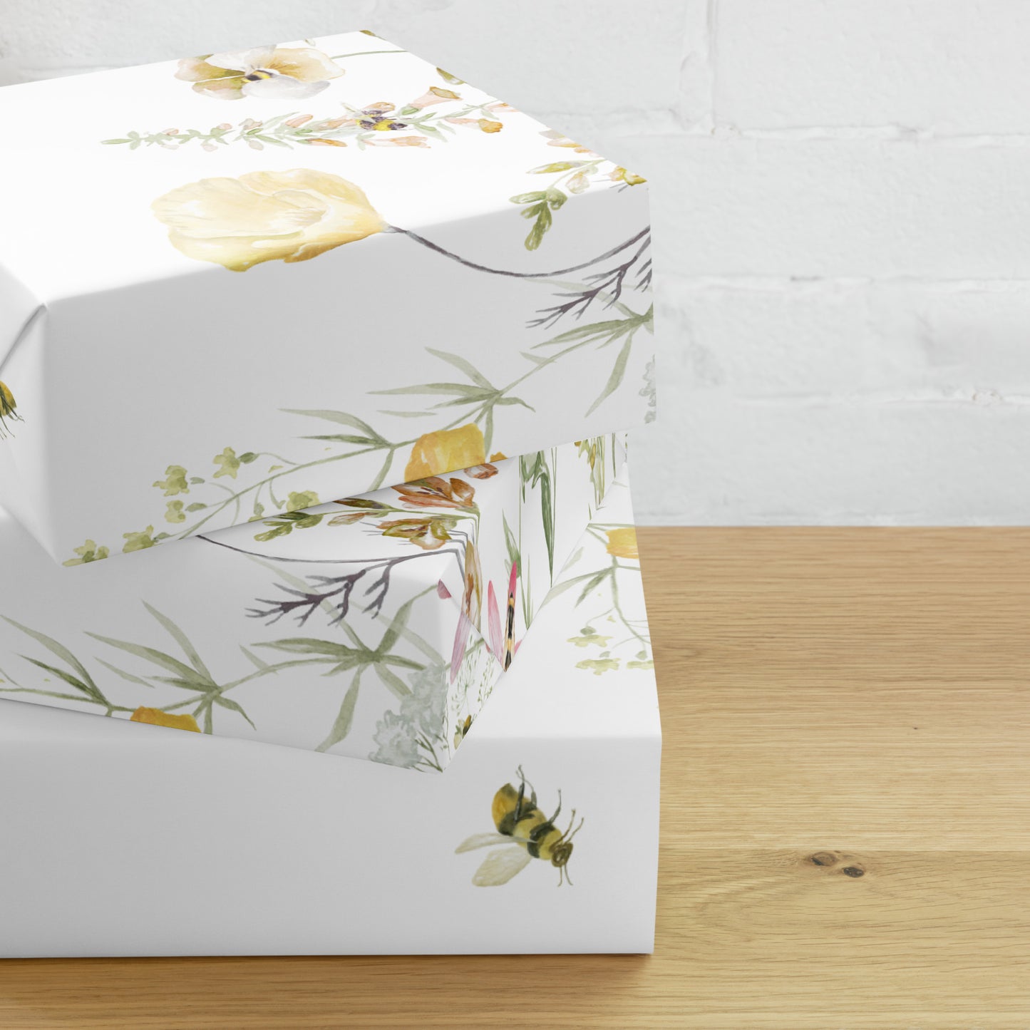 Floral-patterned box on a wooden surface with a white background