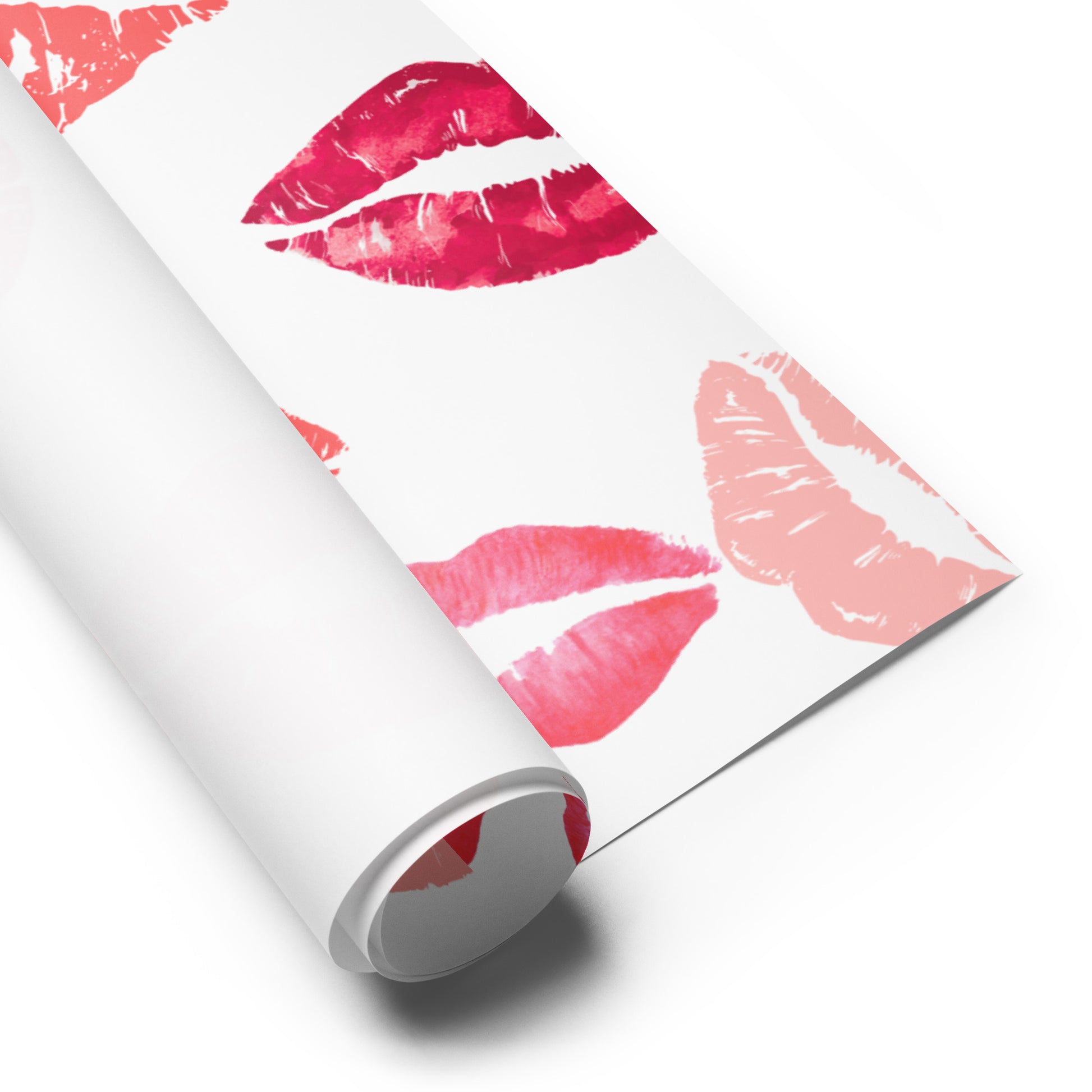 Roll of paper with pink and red lip print design on a white background