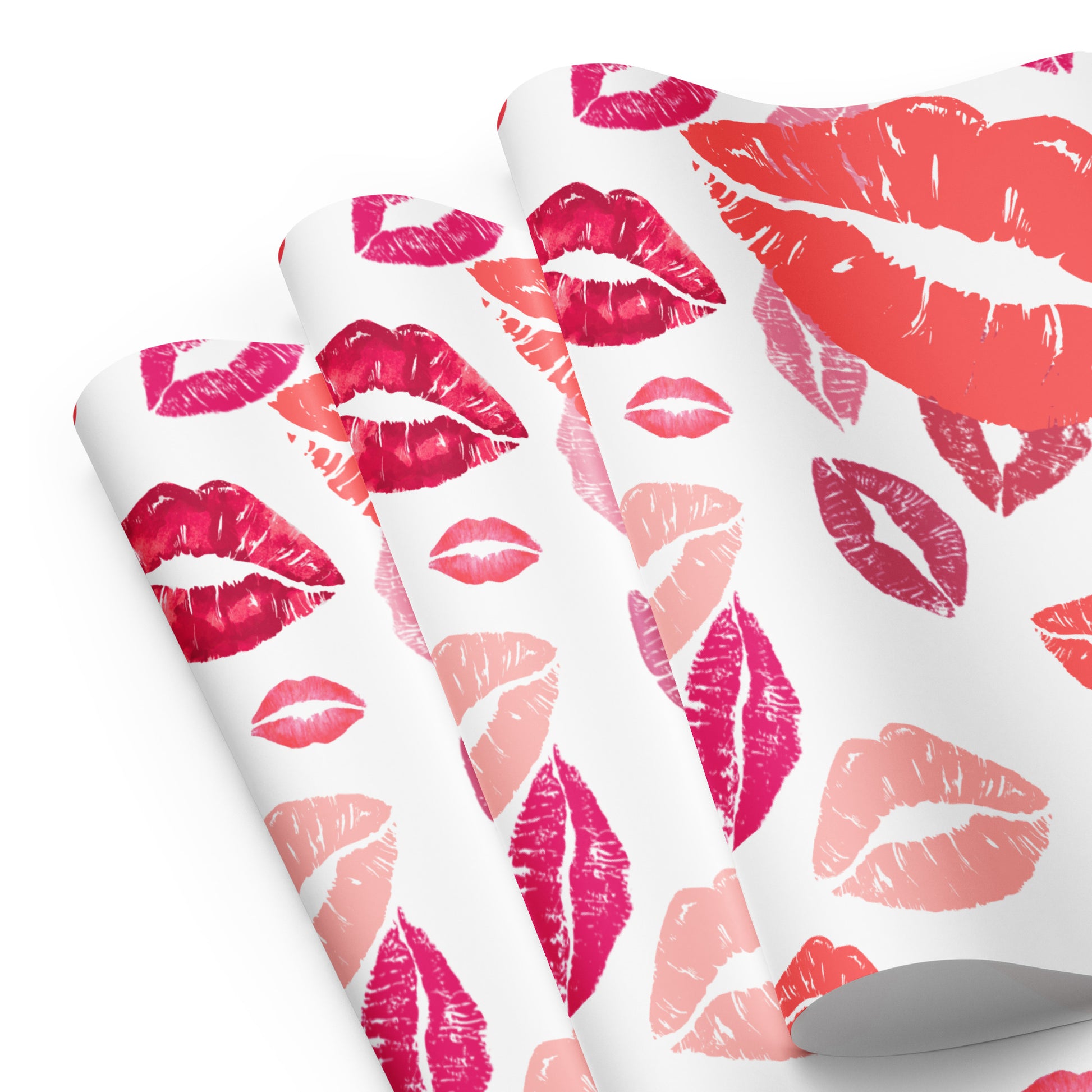 Roll of paper with pink and red lip print pattern on a white background