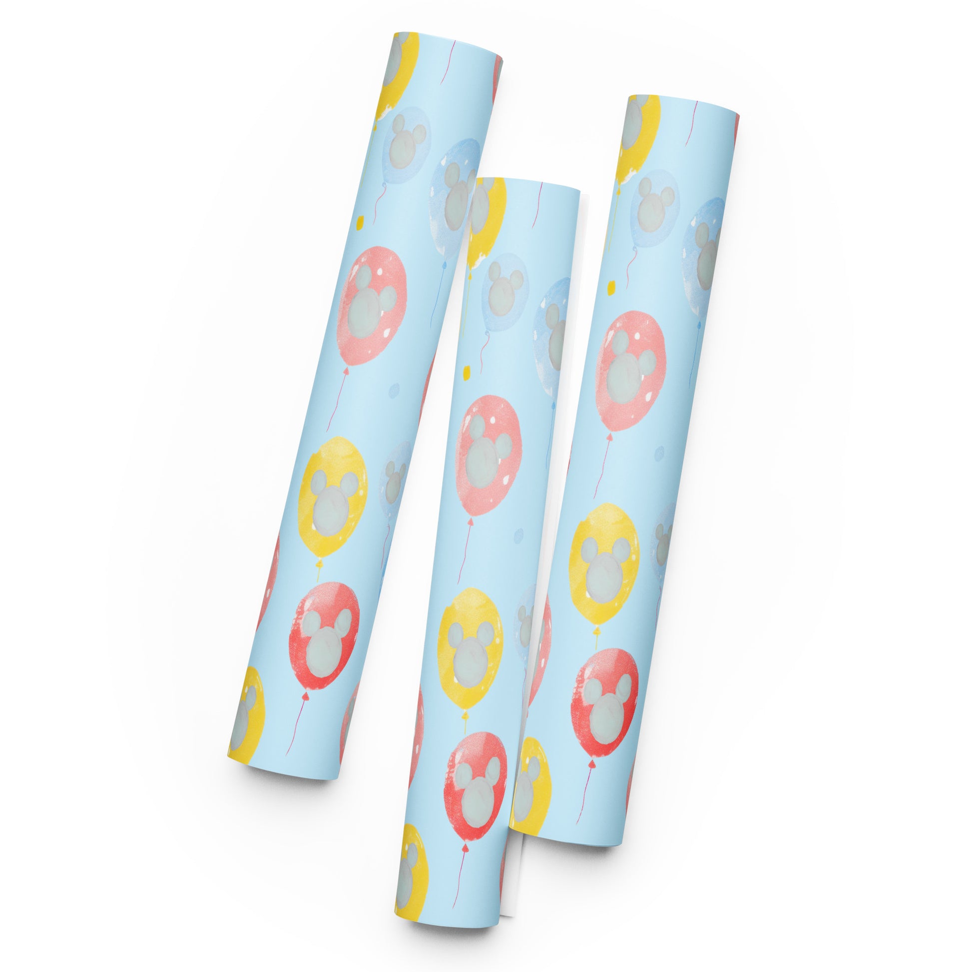 Three cylindrical packages with cartoon character designs on a light blue background