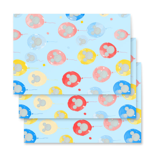 Packaging with colorful balloon pattern on a light blue background