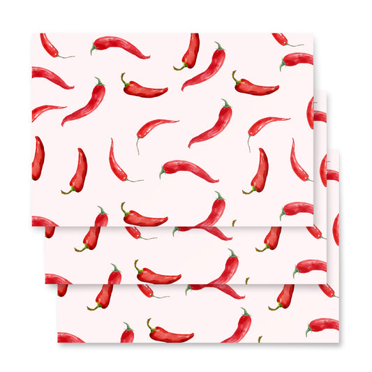 Red chili pepper pattern on a white background