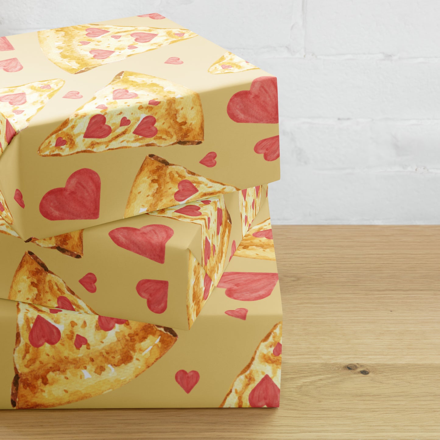Box with pizza slices and heart patterns on a wooden surface