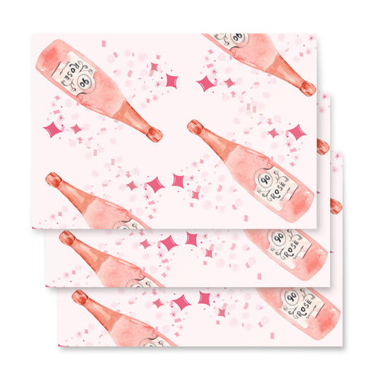 Pattern of pink champagne bottles and confetti on a white background