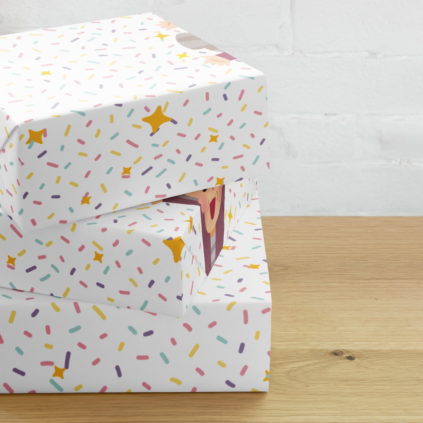Gift box with colorful sprinkles pattern on a wooden surface
