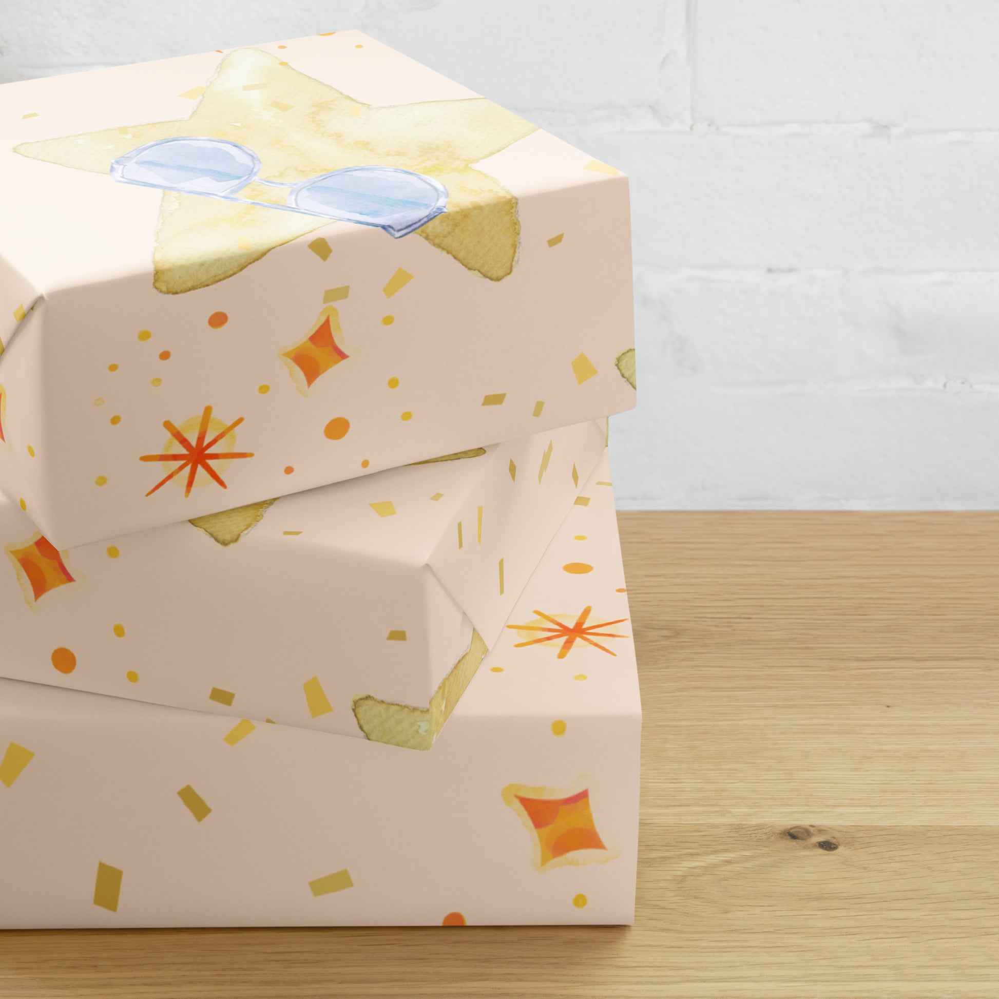 Gift box with colorful star pattern on a wooden surface